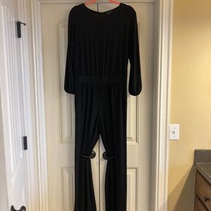 Black jumpsuit with slits in sleeves